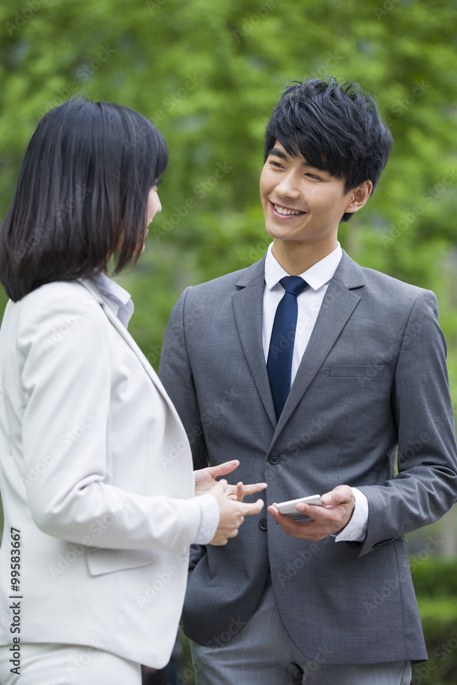 Young businessman and businesswoman discussion Young businessman and businesswoman discussion