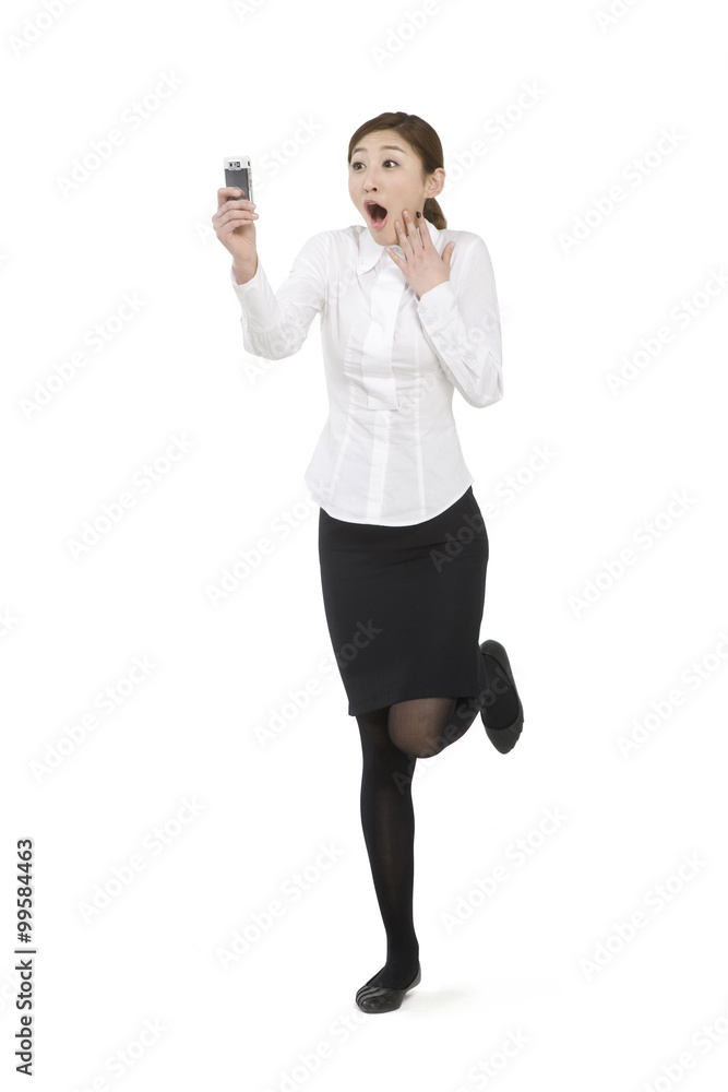 Happy businesswoman holding her mobile phone Happy businesswoman holding her mobile phone