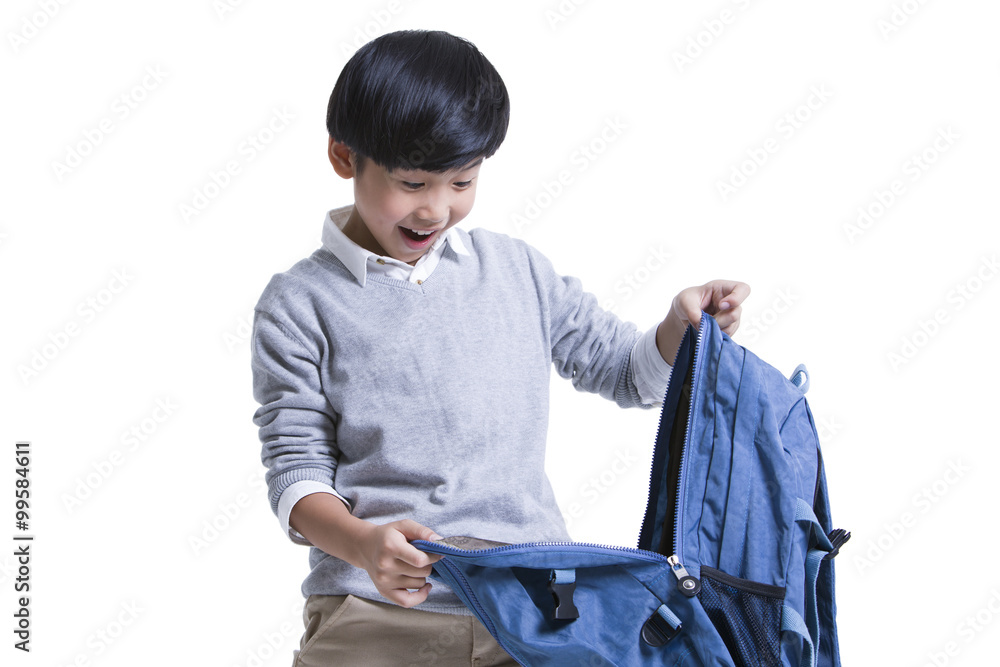 Cute schoolboy opening book bag with surprise Cute schoolboy opening book bag with surprise