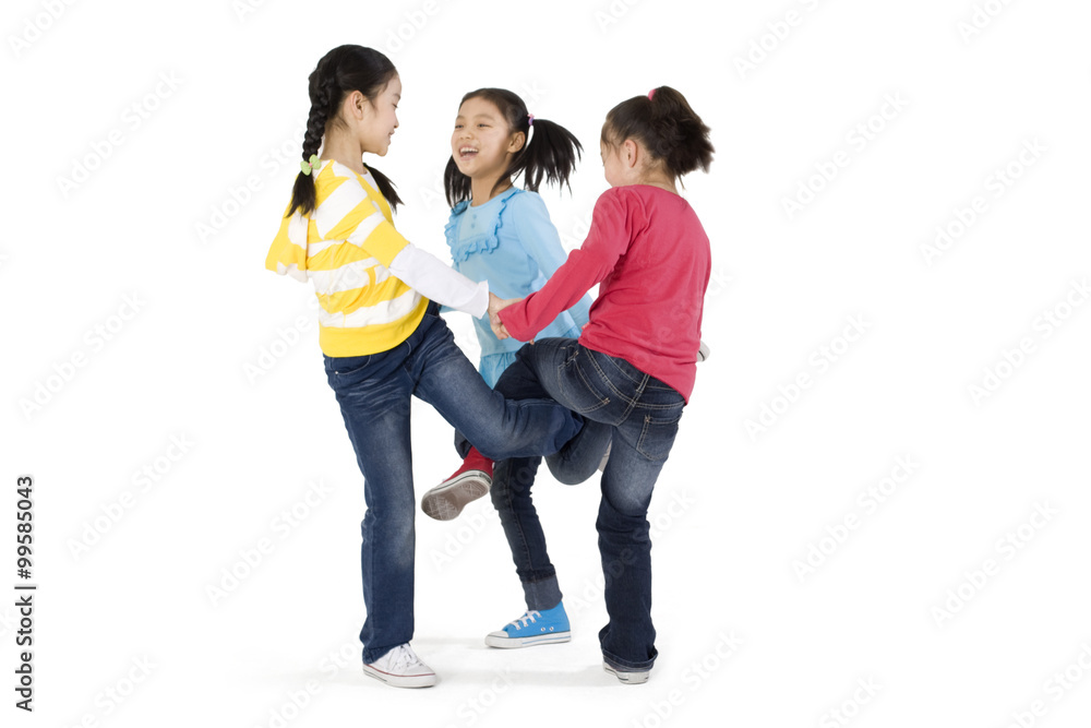 A group of girls playing a leg wrapping game A group of girls playing a leg wrapping game