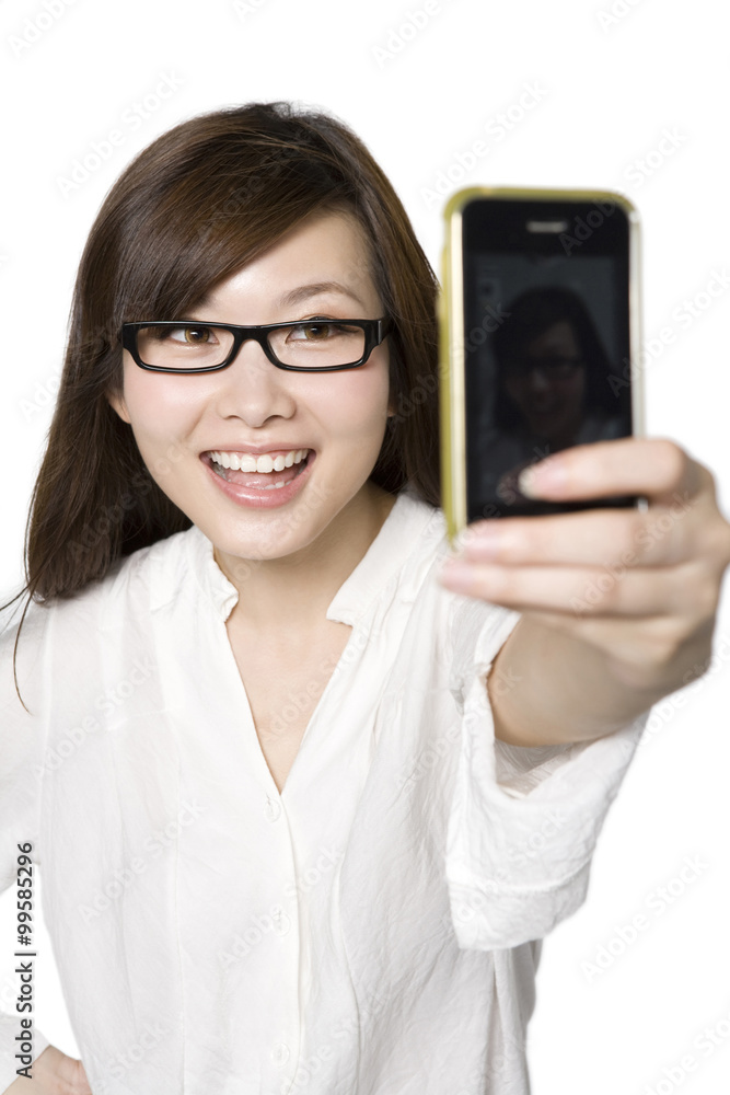 Portrait of Young Woman Taking a Photograph of Herself Portrait of Young Woman Taking a Photograph of Herself