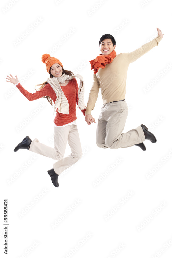 Happy young couple jumping