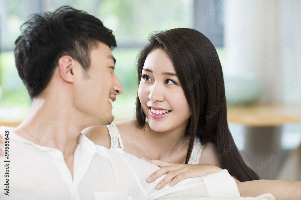 Young couple smiling at each other Young couple smiling at each other