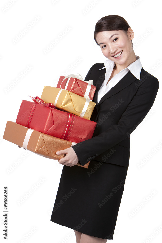 Happy Businesswoman Holding a Stack of Gifts Happy Businesswoman Holding a Stack of Gifts