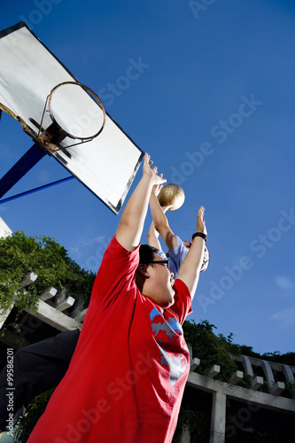 Teenage Boys Playing Basketball