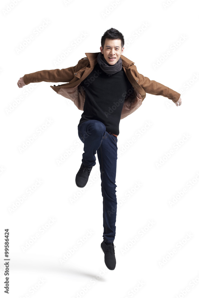 Young man jumping in mid-air Young man jumping in mid-air