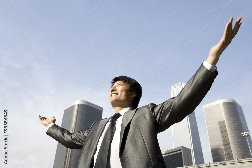 Businessman with Arms Outstretched, Urban Scene Businessman with Arms Outstretched, Urban Scene