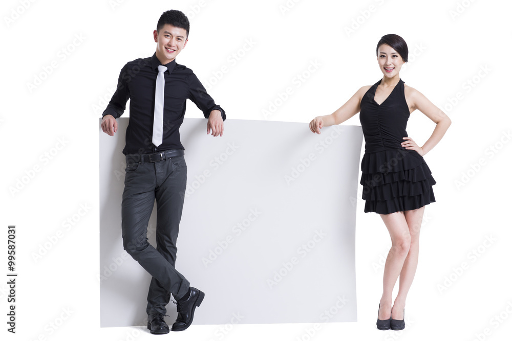 Happy young man and woman with white board Happy young man and woman with white board