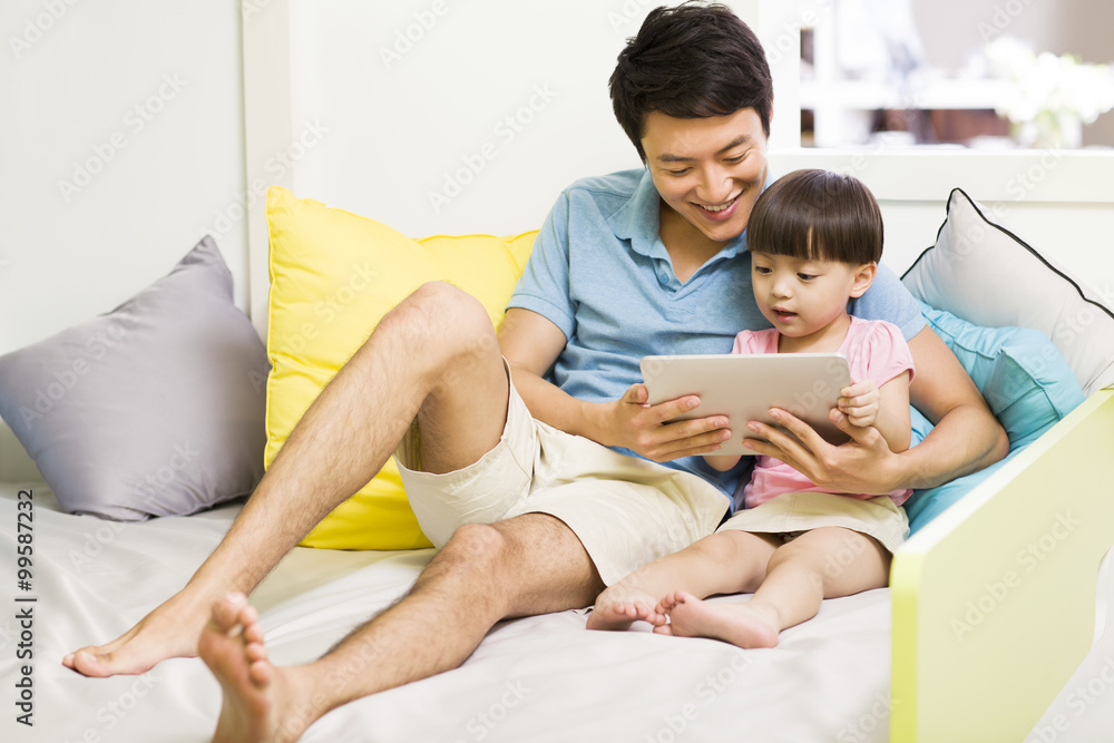 Happy father and daughter with digital tablet Happy father and daughter with digital tablet