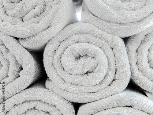 Rolled Up Light Gray Cotton Beach Towel Pattern used as Background Texture