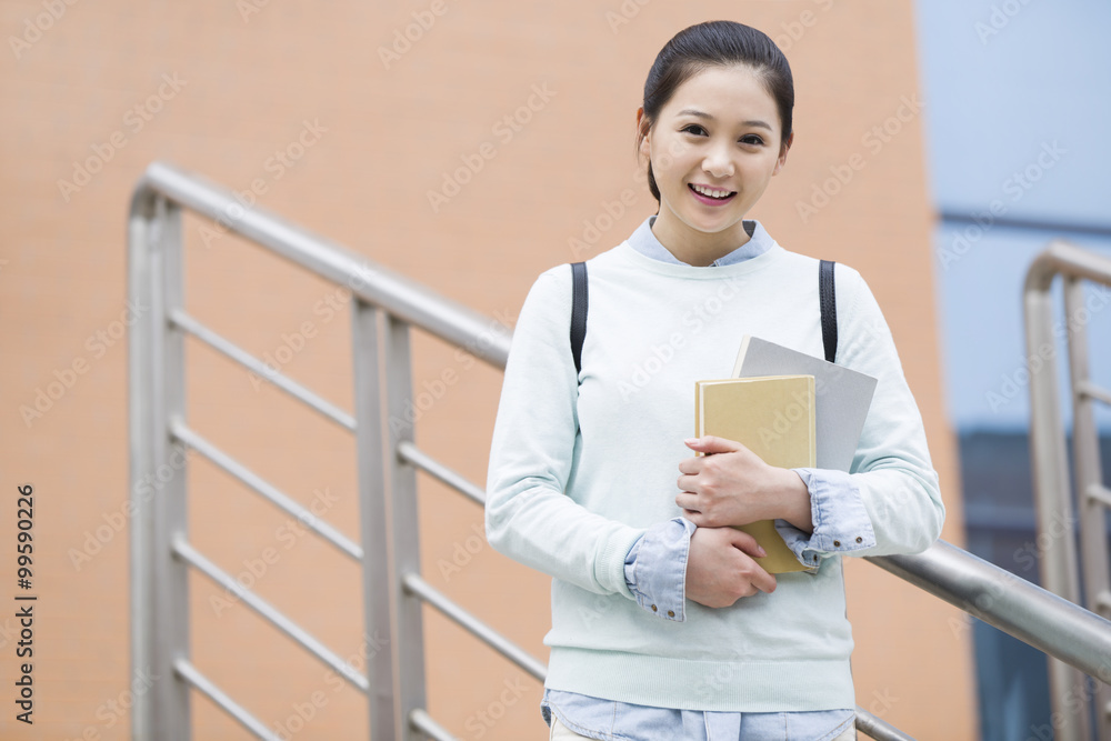 Female college student outside library Female college student outside library