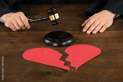 Divorce Lawyer With Broken Heart Hitting Gavel