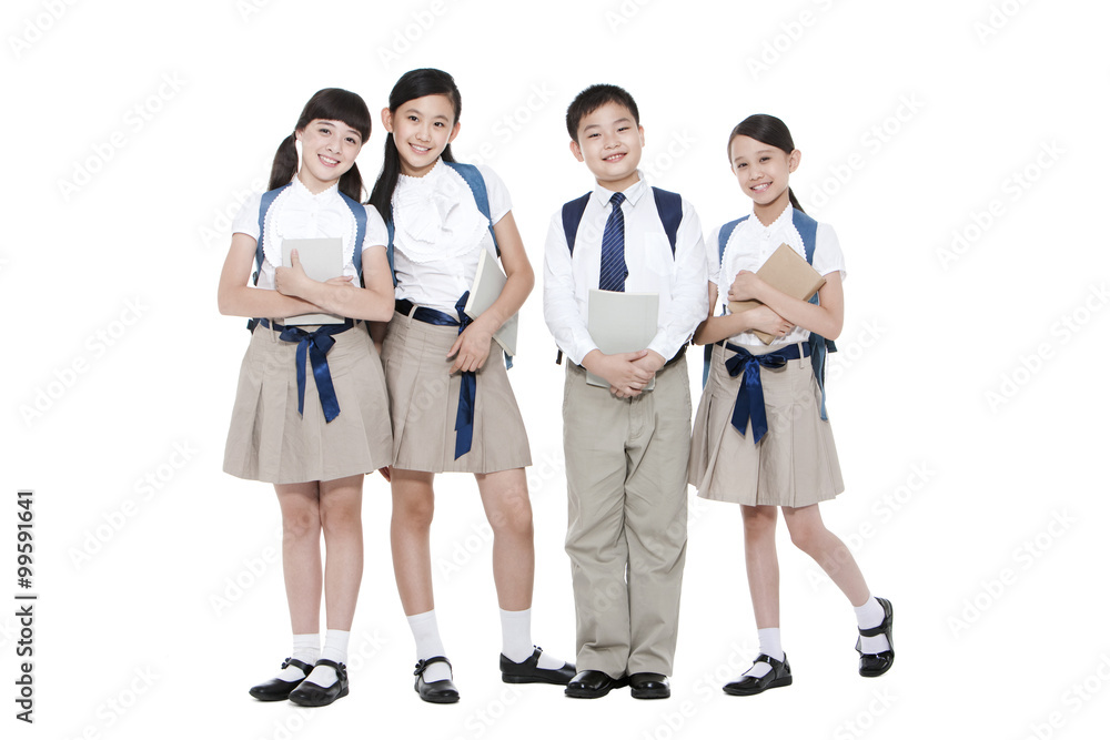 Happy primary school friends with books and schoolbags Happy primary school friends with books and schoolbags