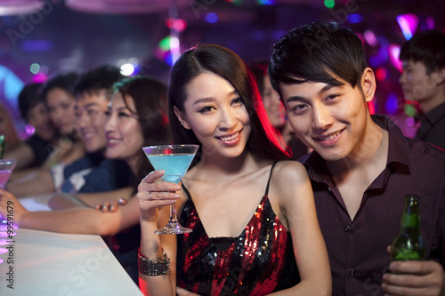 Stylish young people at bar counter