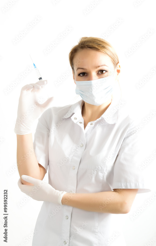 young girl in doctor bathrobe and rubber gloves holding a syringe young girl in doctor bathrobe and rubber gloves holding a syringe