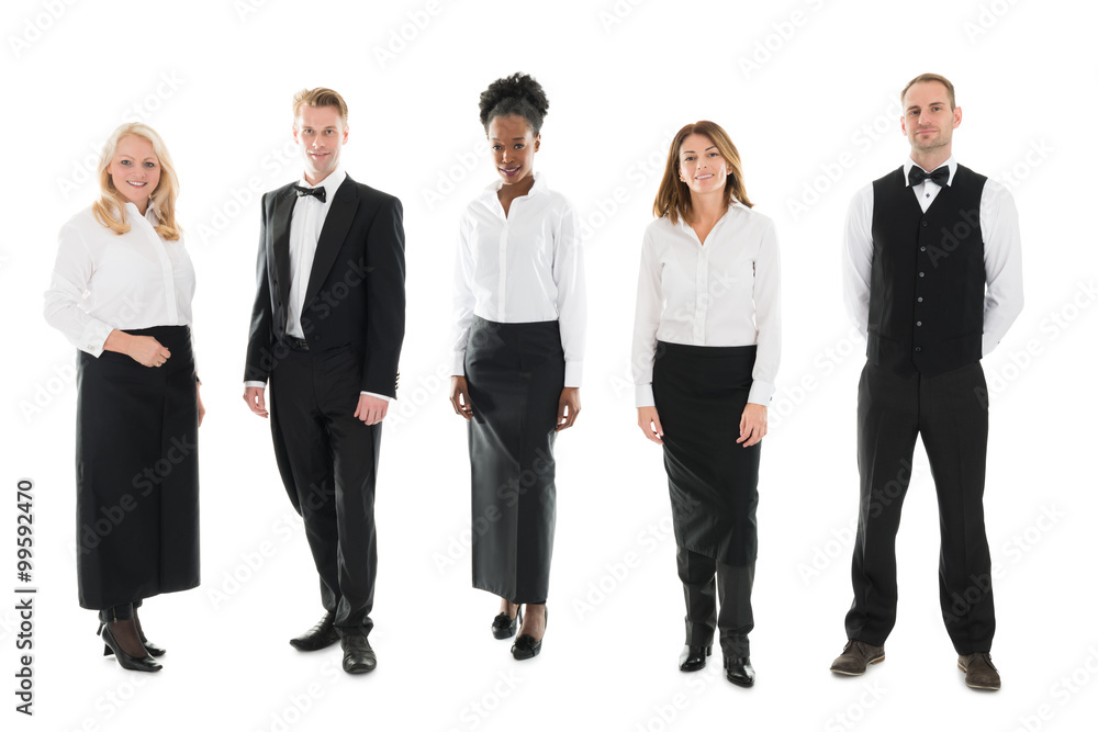 Multi ethnic Restaurant Staff Standing Against White Background