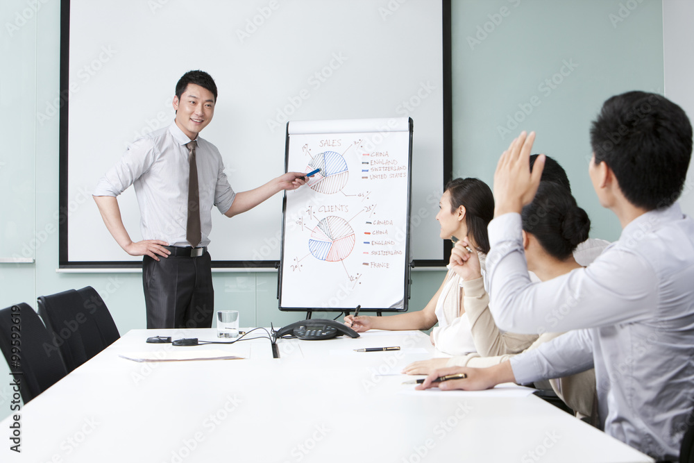 Fototapeta premium Young Businessman Asking Executive Question