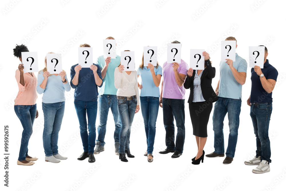 Creative Business Team Hiding Faces With Question Mark Signs