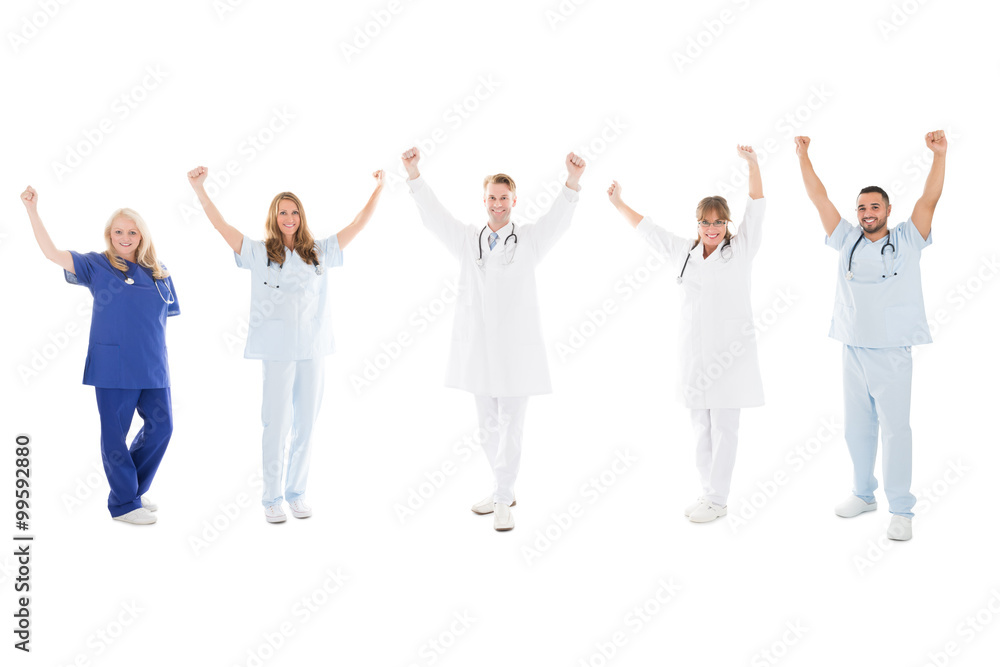 Happy Medical Team Standing With Arms Raised Happy Medical Team Standing With Arms Raised