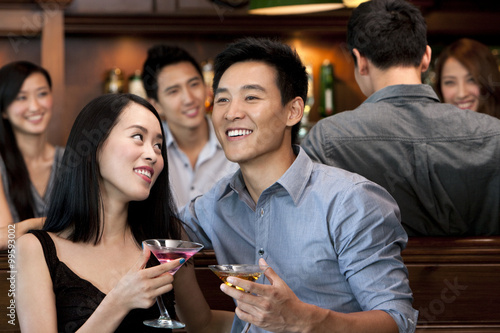 Couple Enjoying Cocktails Together