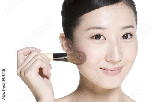 Beauty shot of a young woman with a blusher