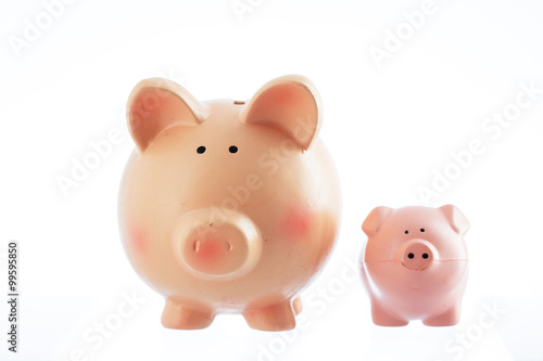 Two piggy bank toys isolated on a white background