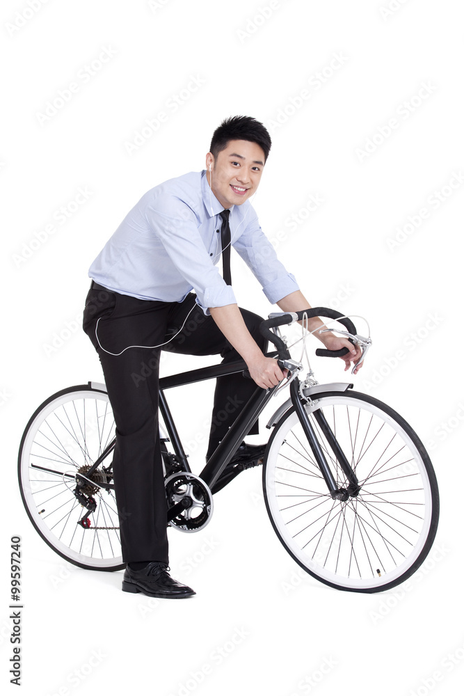 Obraz premium Cheerful young businessman on bike