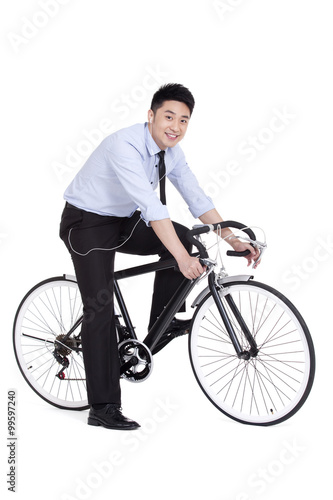 Cheerful young businessman on bike