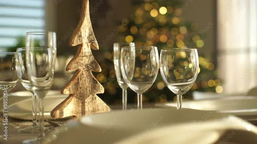 4k footage, dolly move closeup plates and glasses on table at home with christmas in background, captured with atomos shogun
