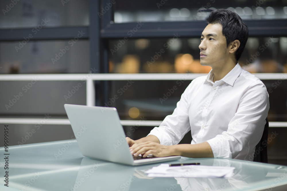 Young businessman working in office Young businessman working in office