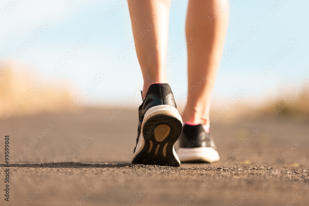 Woman walking on a path. (Fitness concept)
 - obrazy, fototapety, plakaty 