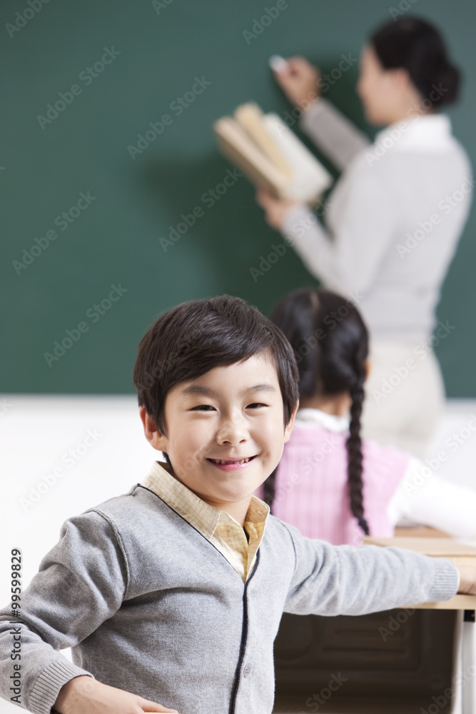 Cheerful schoolchildren and teacher in a conversation Cheerful schoolchildren and teacher in a conversation