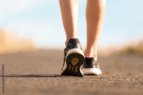 Woman walking on a path. (Fitness concept) 