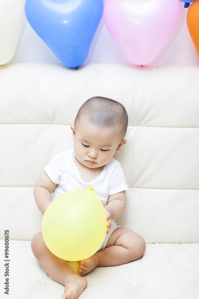 Chinese baby boy and colorful balloons Chinese baby boy and colorful balloons