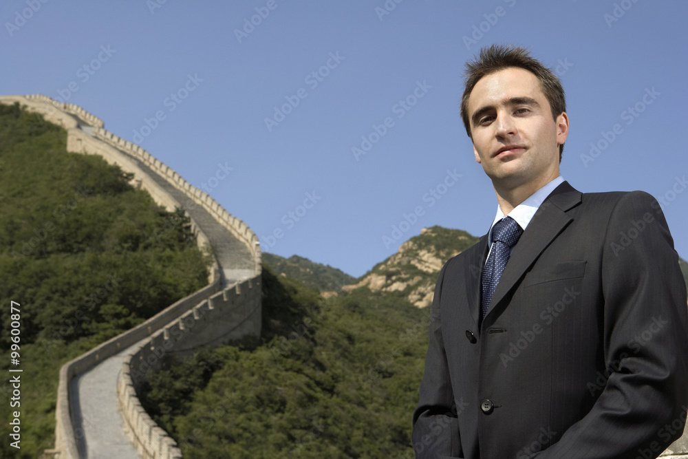 Businessman Standing On The Great Wall Of China Businessman Standing On The Great Wall Of China