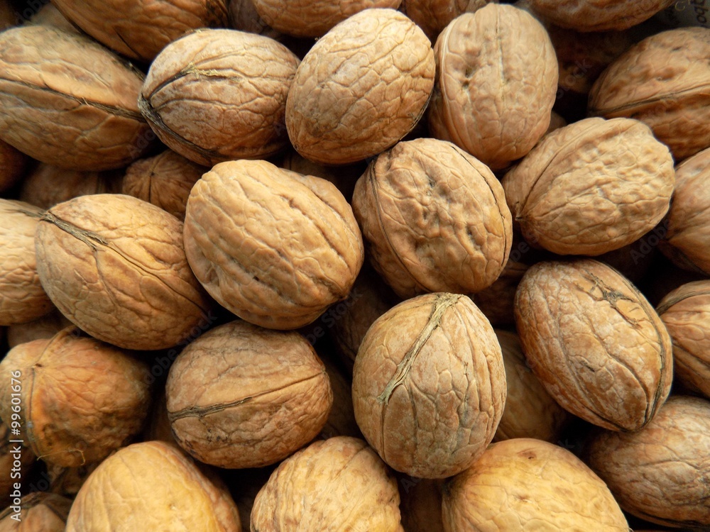 Walnuts in nutshell texture Walnuts in nutshell texture