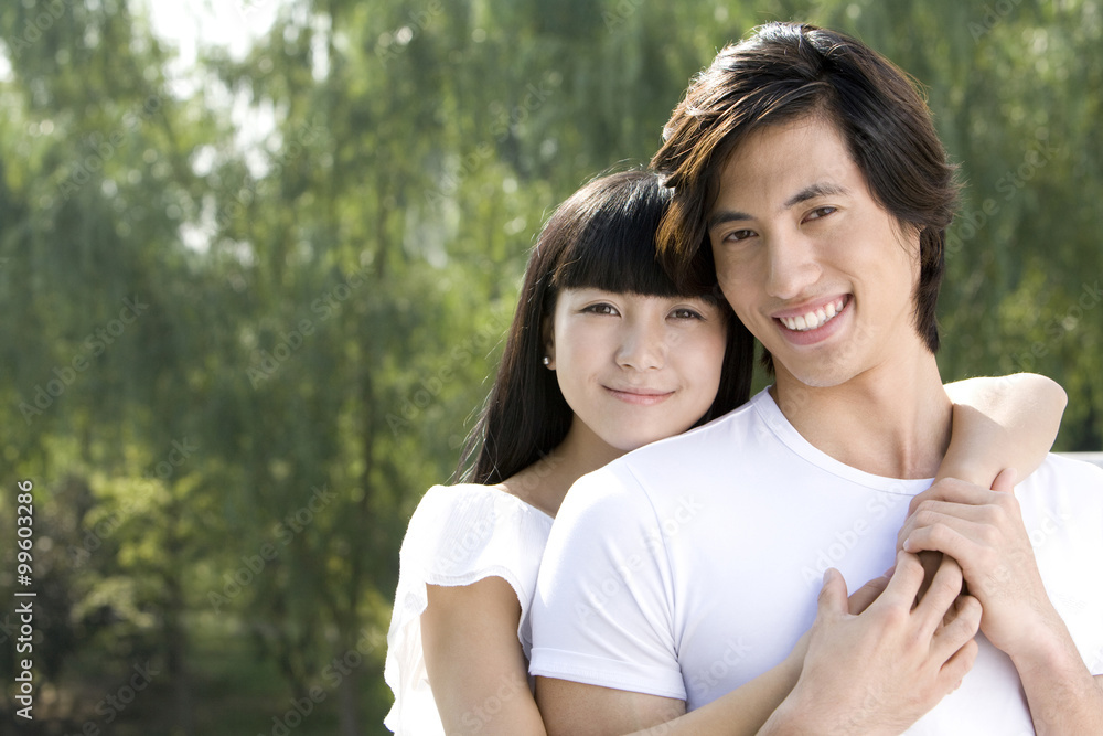 Young couple embracing each other outdoors Young couple embracing each other outdoors