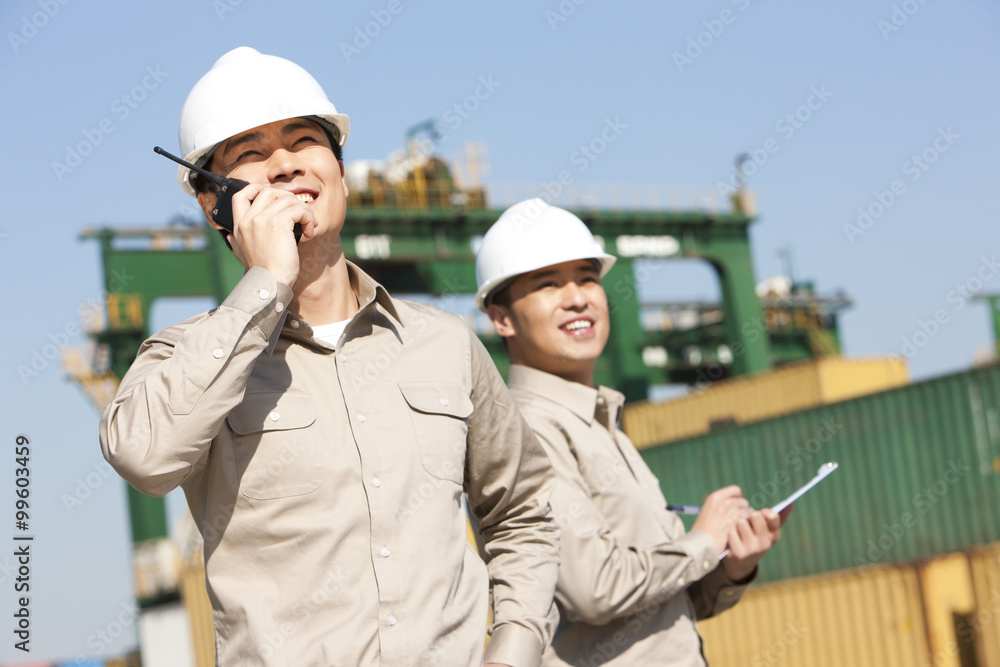Male shipping industry workers at work Male shipping industry workers at work