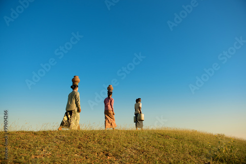 Group Asian Burmese traditional farmers walking home