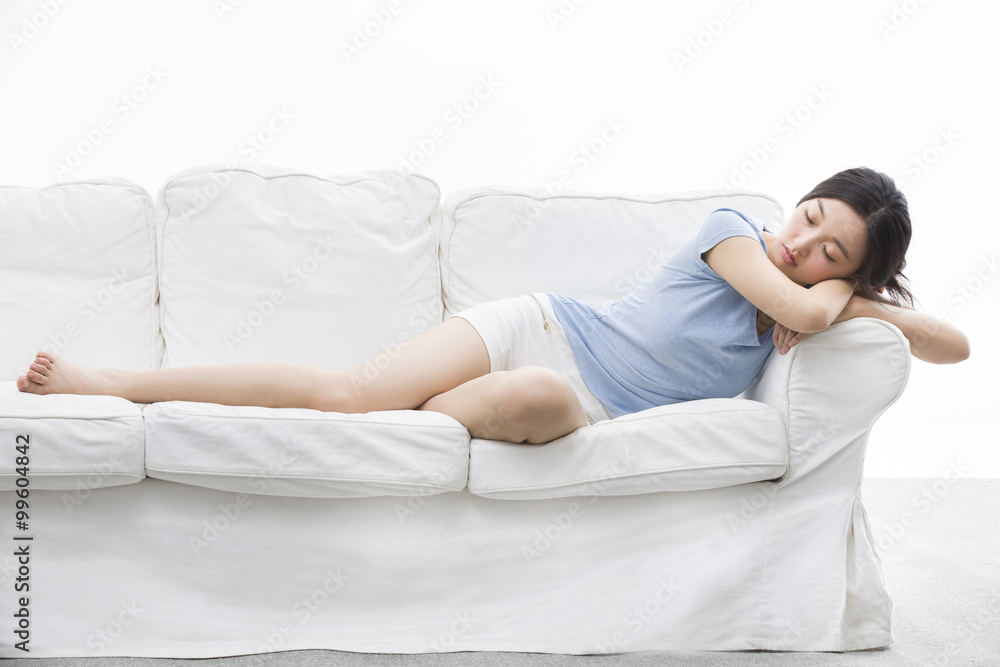 Young woman sleeping on couch