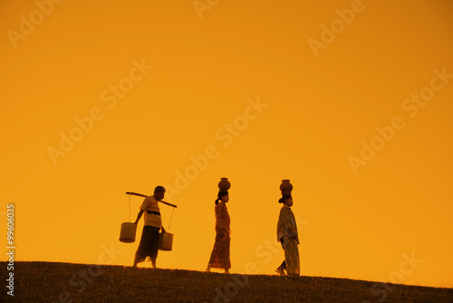 Silhouette of Asian traditional farmers