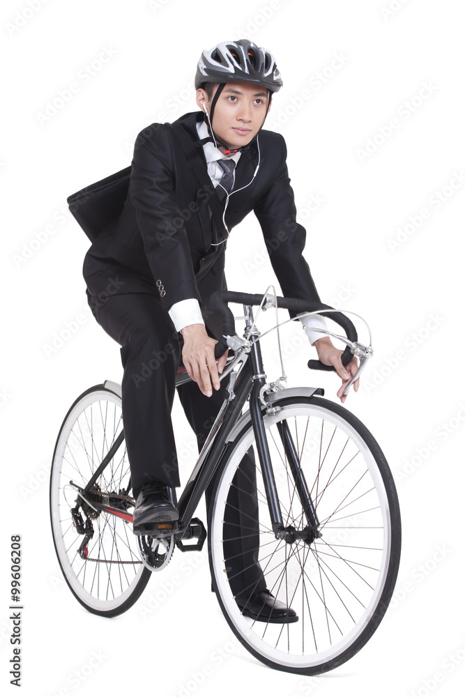 Naklejka premium young businessman riding a bike