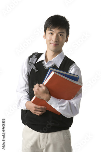 Schoolboy holding his books