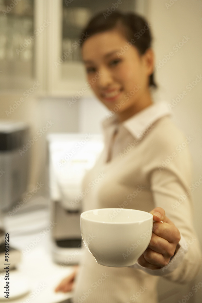 Young Woman Holding Coffee Cup Young Woman Holding Coffee Cup
