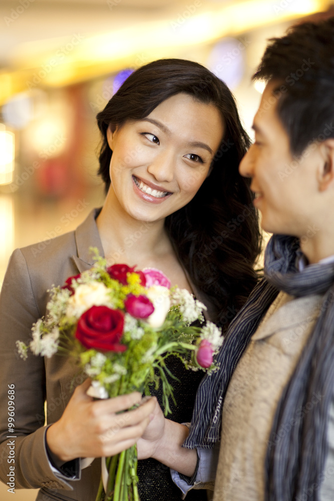 Young couple with flowers Young couple with flowers