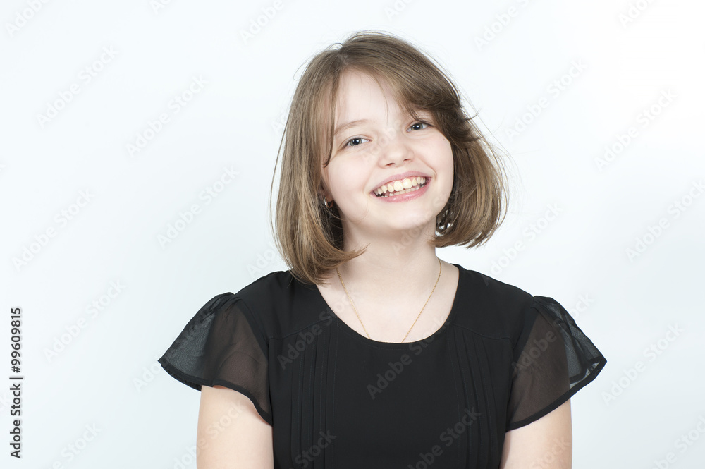 Portrait of a smiling girl in a black blouse.. Portrait of a smiling girl in a black blouse..