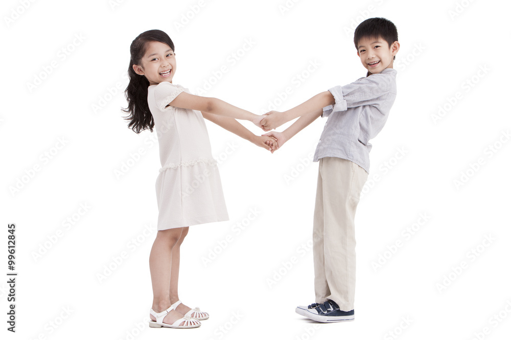 Little girl and boy holding hands