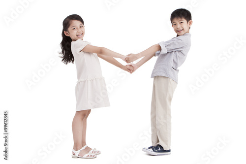 Little girl and boy holding hands