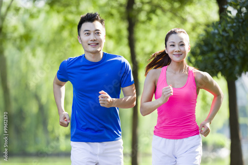 Young couple jogging in park