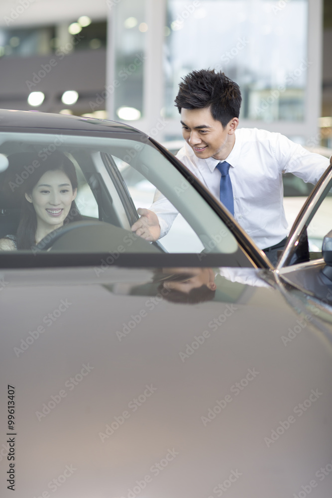 Young woman taking a test drive Young woman taking a test drive